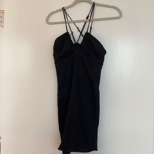 Free People || black tight mini dress with crossed straps in the back